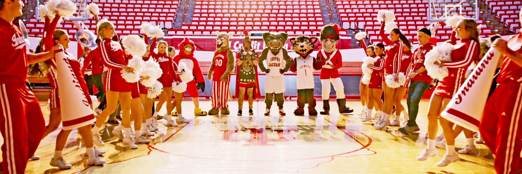 All IU mascots stand between two lines of IU cheerleaders
